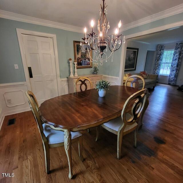 1905 Topsfield Court Raleigh, NC 27615 - Photo 25 of 45 a view of a dining room with furniture and wooden floor
