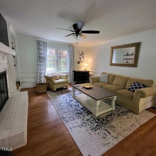 1905 Topsfield Court Raleigh, NC 27615 - Photo 26 of 45 a living room with furniture a flat screen tv and a fireplace