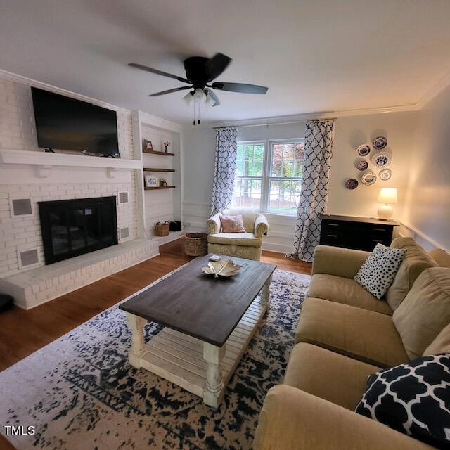 1905 Topsfield Court Raleigh, NC 27615 - Photo 27 of 45 a living room with furniture a flat screen tv and a fireplace