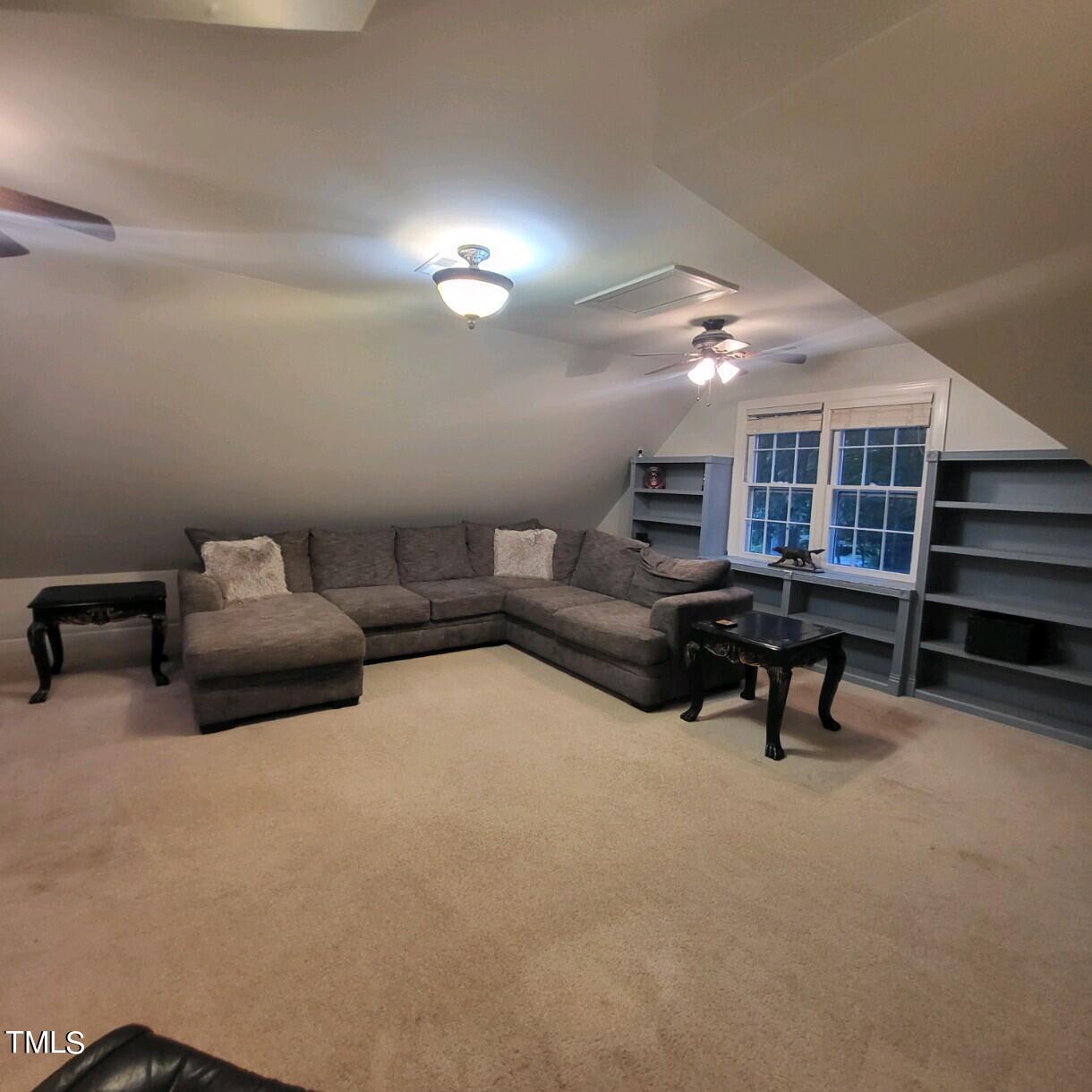 1905 Topsfield Court Raleigh, NC 27615 - Photo 28 of 45 a living room with furniture and a table