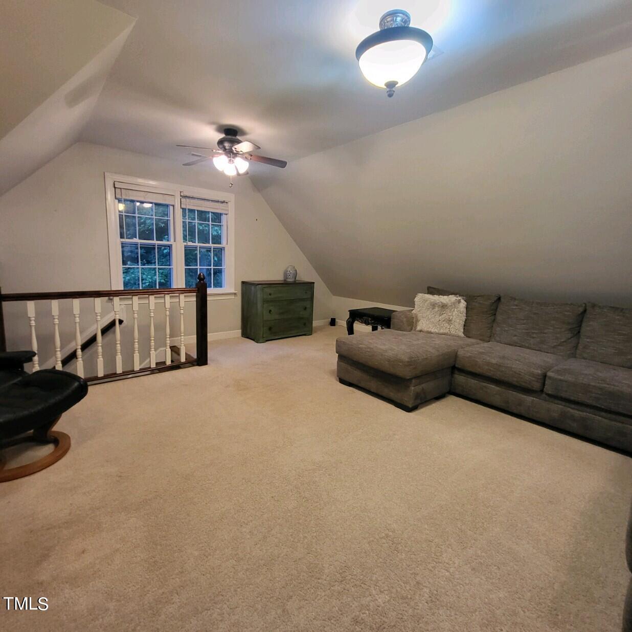 1905 Topsfield Court Raleigh, NC 27615 - Photo 29 of 45 a living room with furniture gym equipment and a window