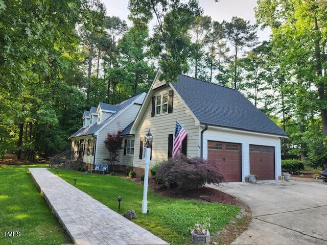 1905 Topsfield Court Raleigh, NC 27615 - Photo 4 of 45 a front view of a house with a yard