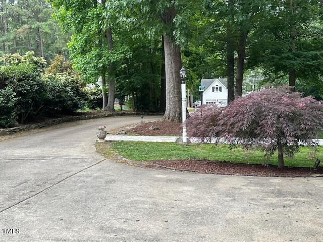 1905 Topsfield Court Raleigh, NC 27615 - Photo 6 of 45 a front view of a house with a yard