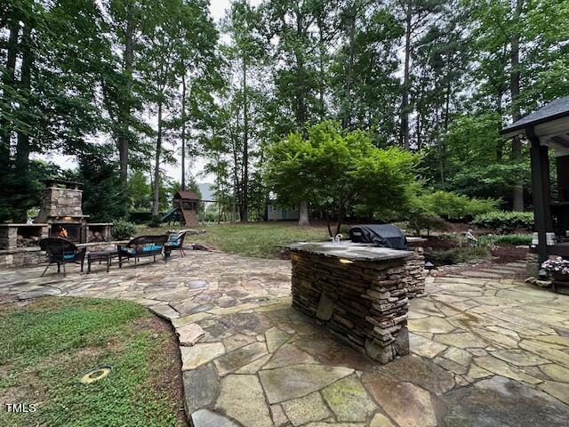 1905 Topsfield Court Raleigh, NC 27615 - Photo 9 of 45 a view of backyard with sitting area and garden