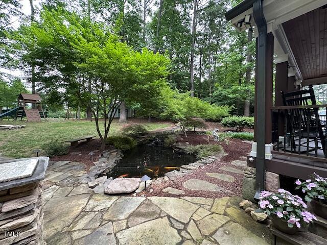 1905 Topsfield Court Raleigh, NC 27615 - Photo 10 of 45 a view of a garden with flowers and trees