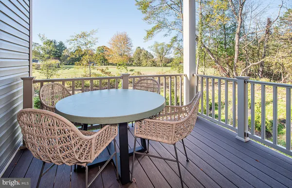 a view of a chairs on the roof deck