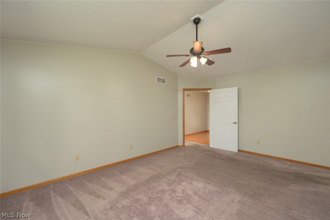 1048 Susan Road Ravenna, OH 44266 - Photo 25 of 35 Bedroom with ceiling fan and carpet