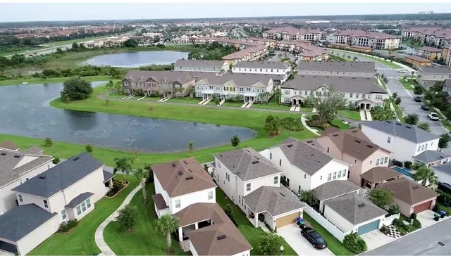 an aerial view of a house with a lake view
