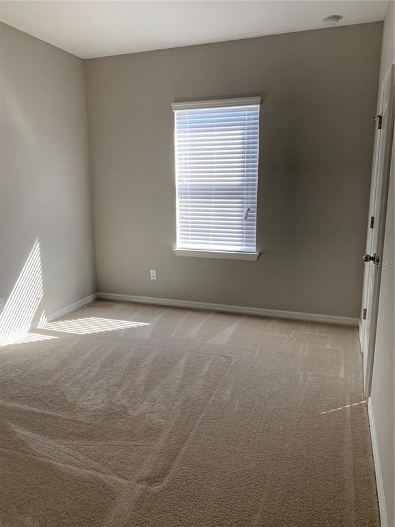 Undisclosed Address Windermere, FL 34786 - Photo 7 of 8 an empty room with a window