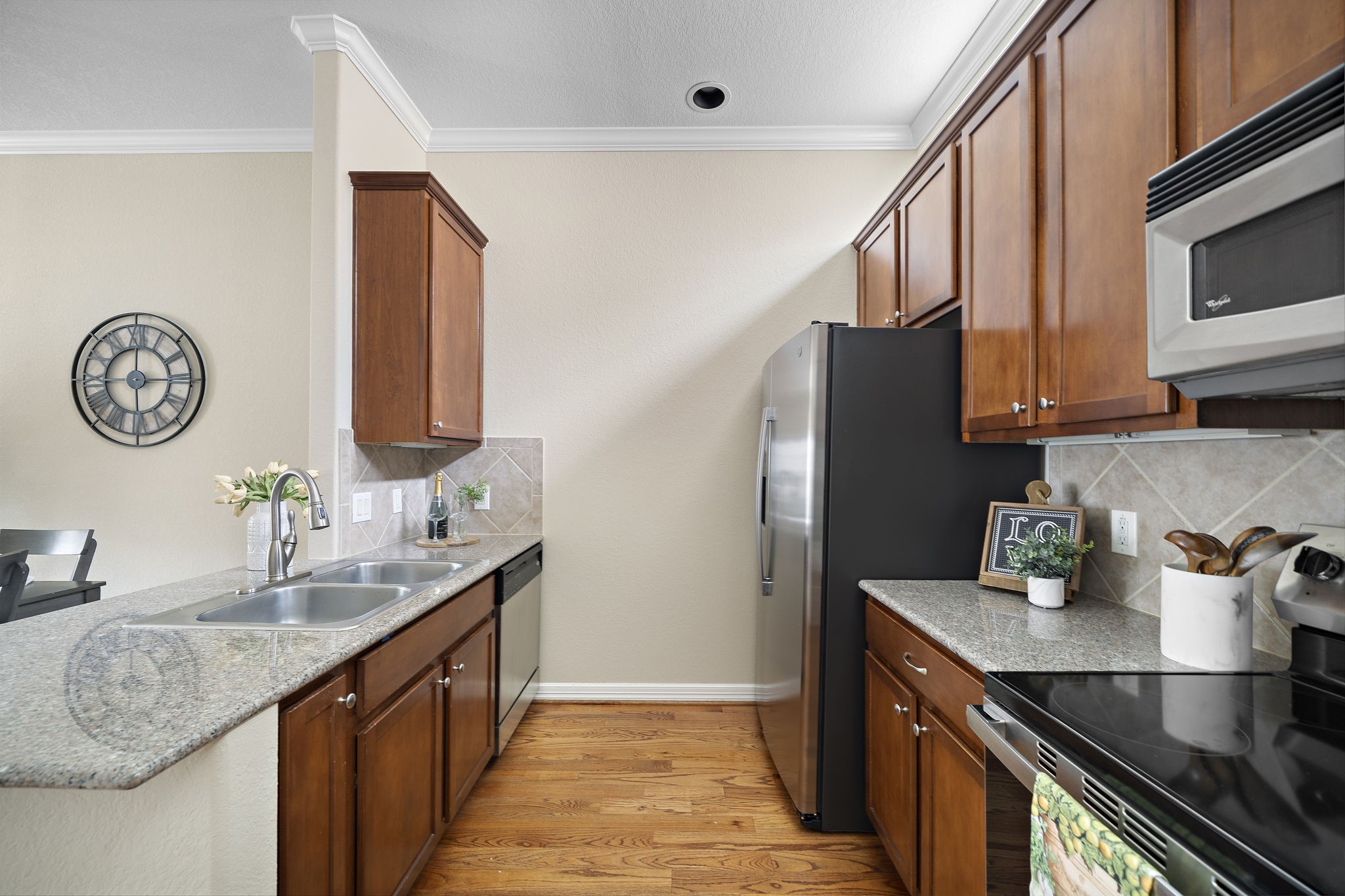 1913 Gillette Street, Unit C Houston, TX 77006 - Photo 3 of 23 a kitchen with stainless steel appliances granite countertop a sink stove and refrigerator