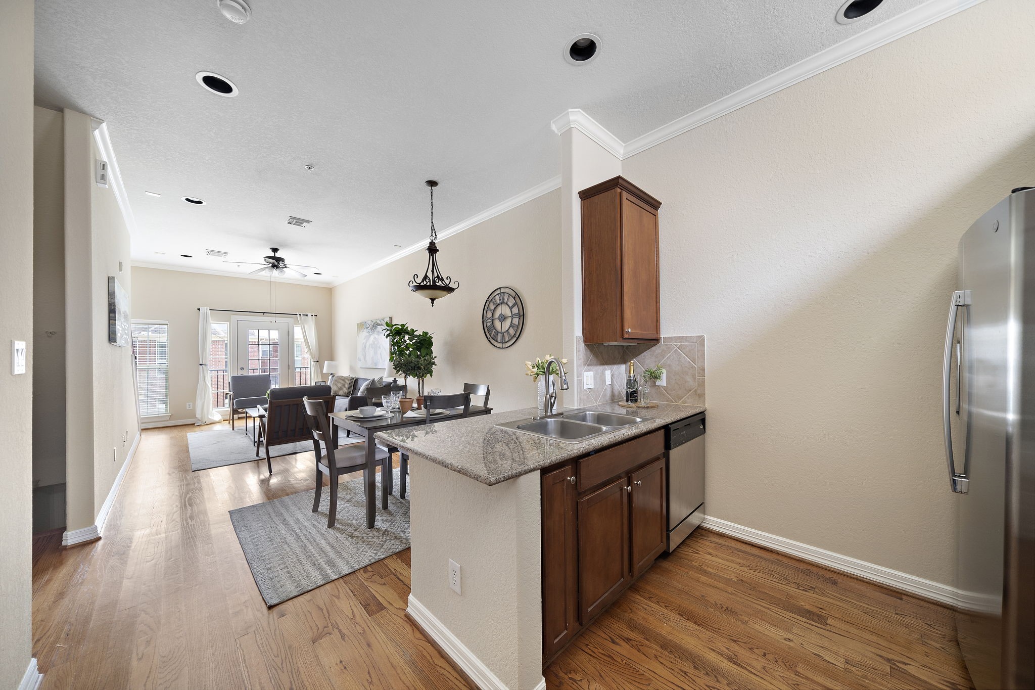 1913 Gillette Street, Unit C Houston, TX 77006 - Photo 5 of 23 a view of a kitchen counter space and wooden floor