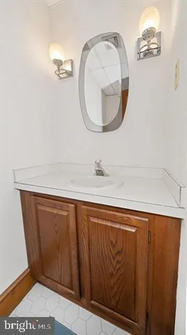 a very nice looking room with wooden floor and furniture