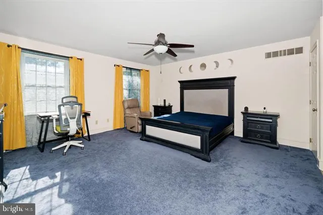 a view of a house with wooden deck