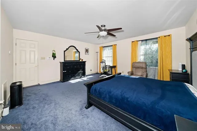 a bedroom with a bed and a night stand