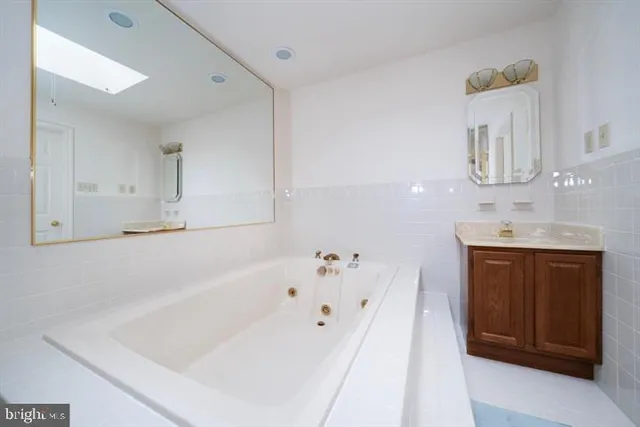 a bedroom with a bed and a chair