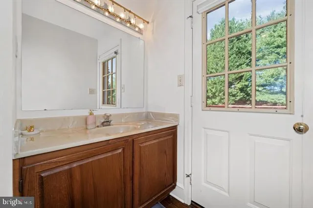 a bathroom with a sink and mirror