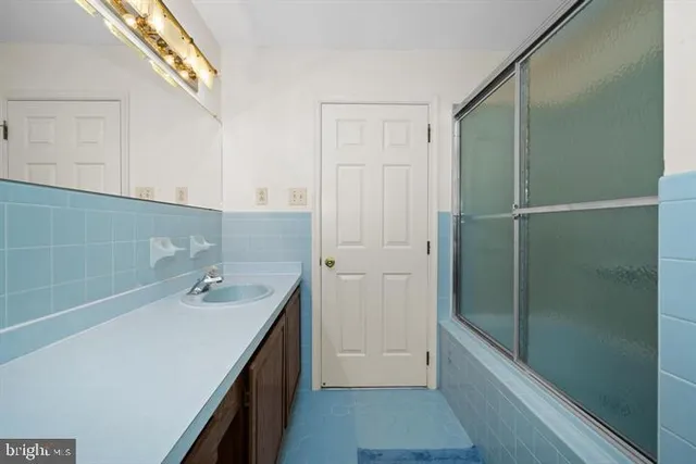 a backyard of a house with lots of green space and lake view