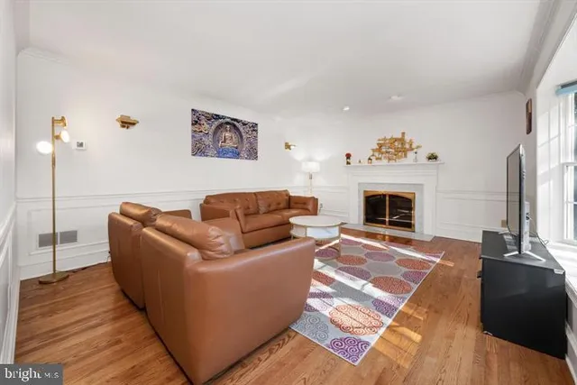 a kitchen with stainless steel appliances granite countertop a stove a sink dishwasher and cabinets with wooden floor