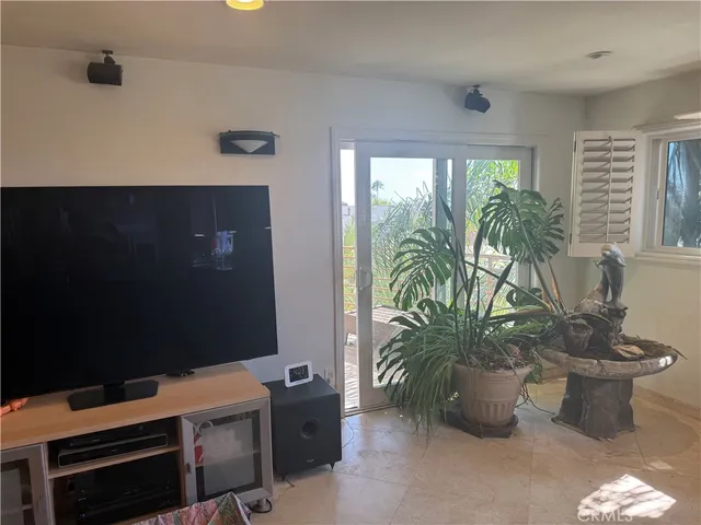a kitchen with refrigerator and windows