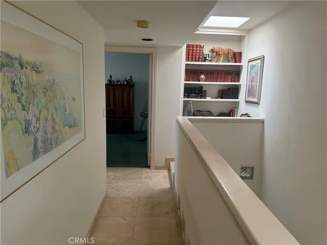 a bedroom with a bed dresser and a window