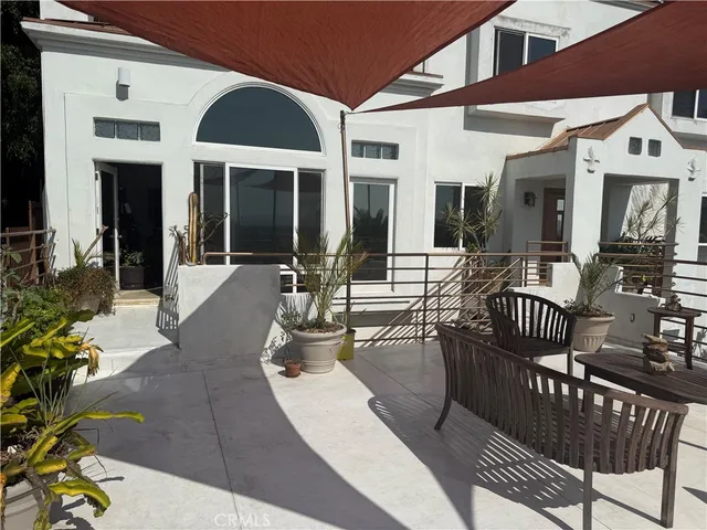 a view of the house with patio outdoor seating