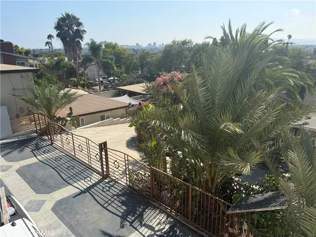 a view of a balcony with chairs