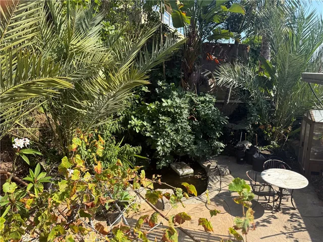 a view of a dinning tables and chairs in a patio