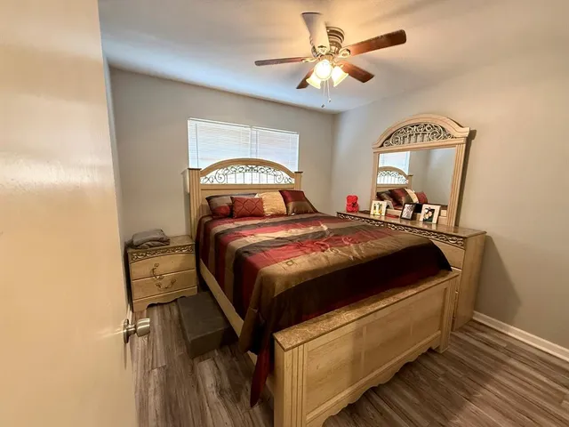 a bed room with a bed and a chandelier