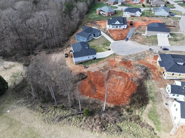 an aerial view of residential houses with outdoor space