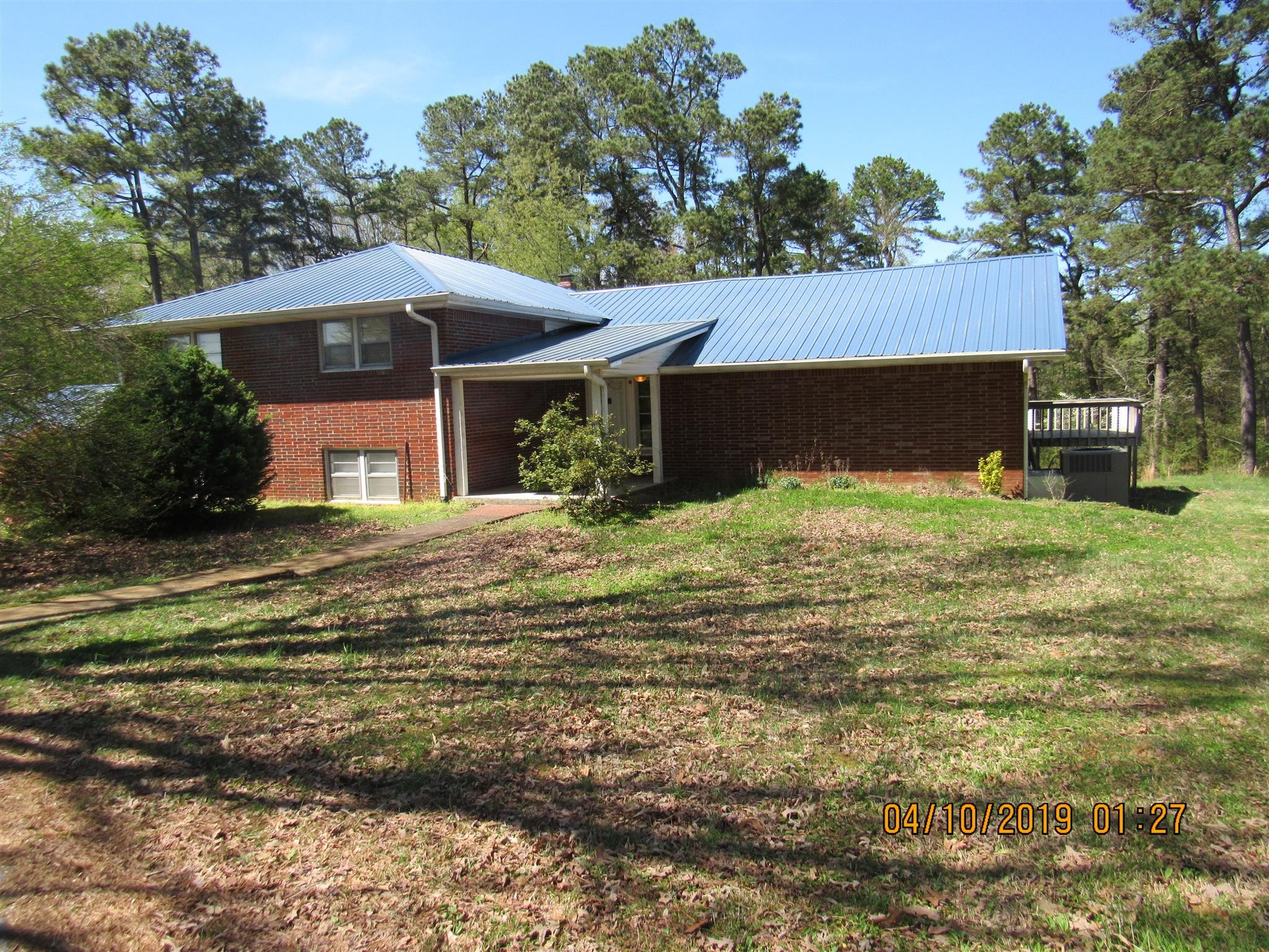 a view of house with yard