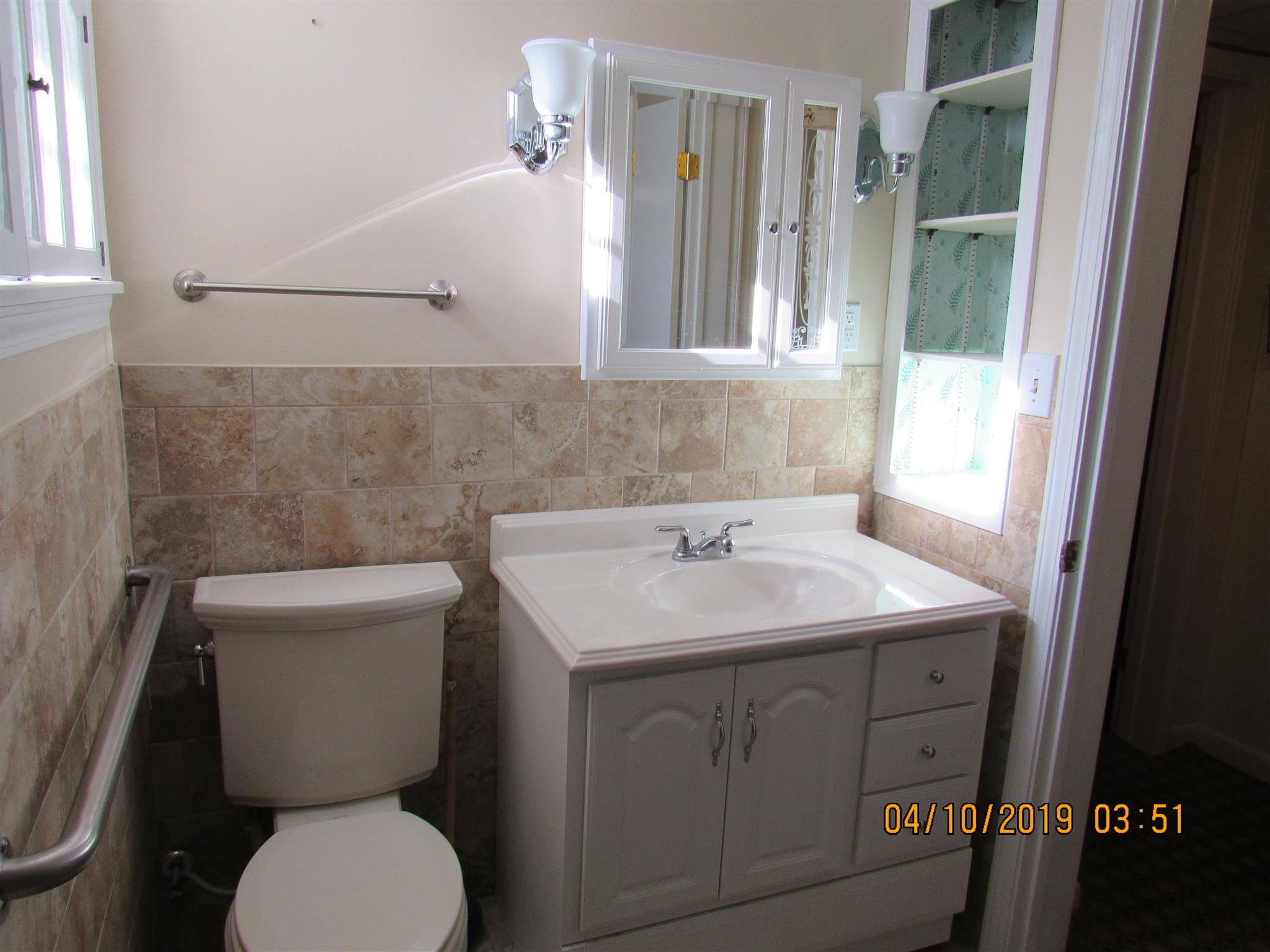 244 Pine Thicket Road McEwen, TN 37101 - Photo 16 of 26 a bathroom with a toilet sink and mirror