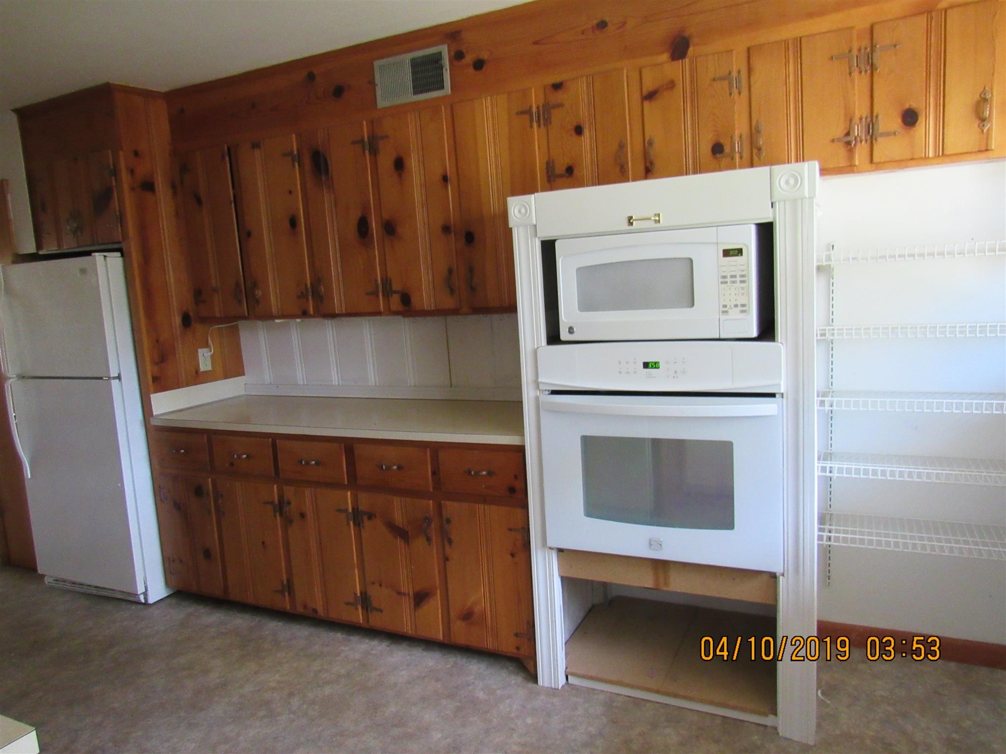 244 Pine Thicket Road McEwen, TN 37101 - Photo 18 of 26 a kitchen with a refrigerator and a stove