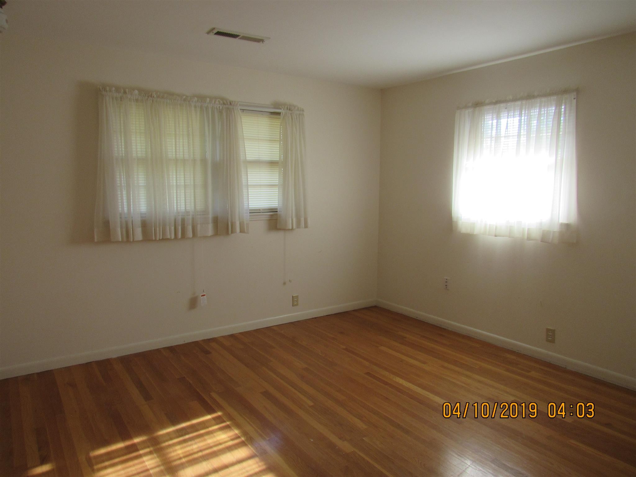 244 Pine Thicket Road McEwen, TN 37101 - Photo 24 of 26 an empty room with wooden floor and windows