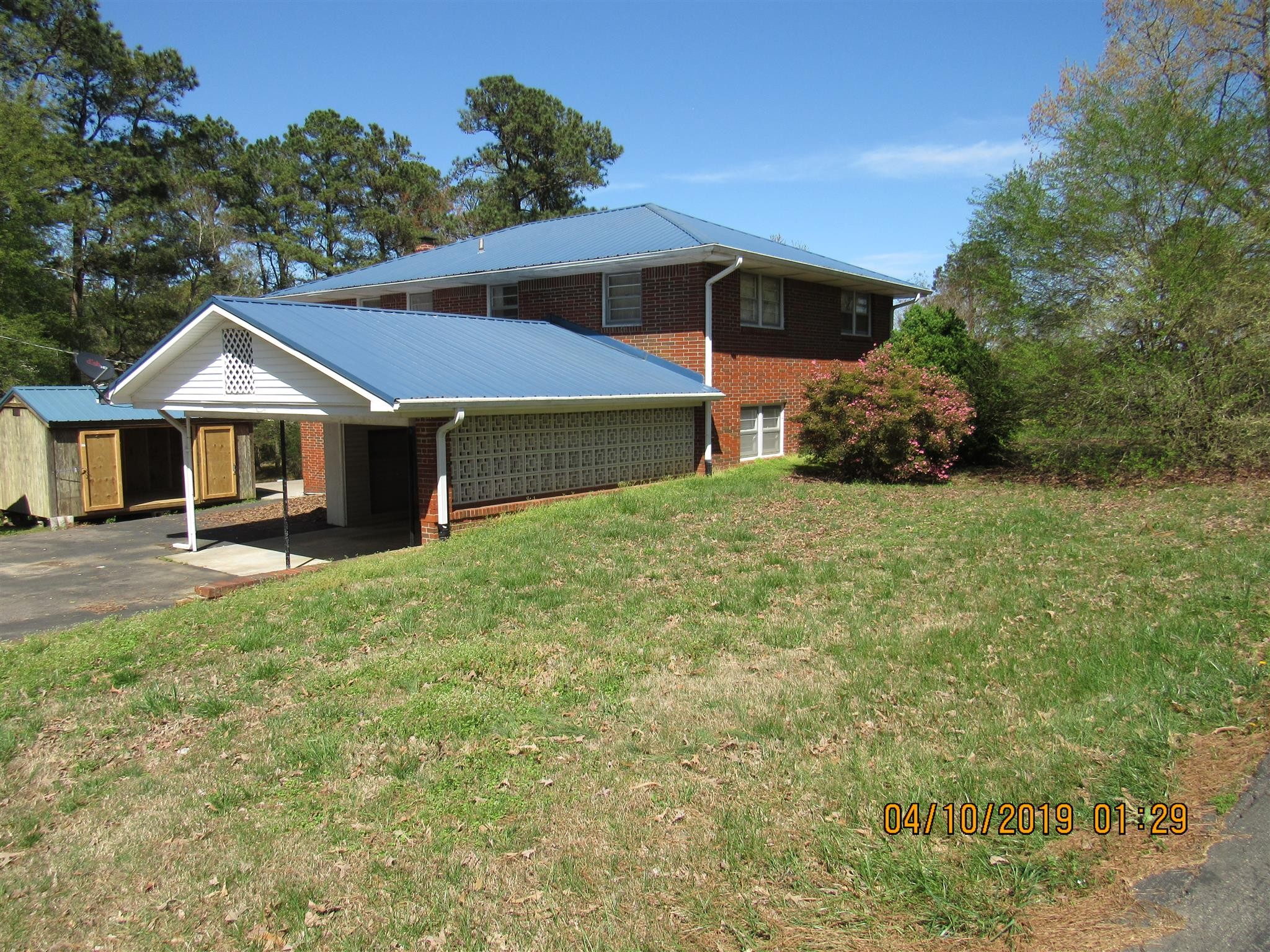 244 Pine Thicket Road McEwen, TN 37101 - Photo 3 of 26 a house with green field in front of it