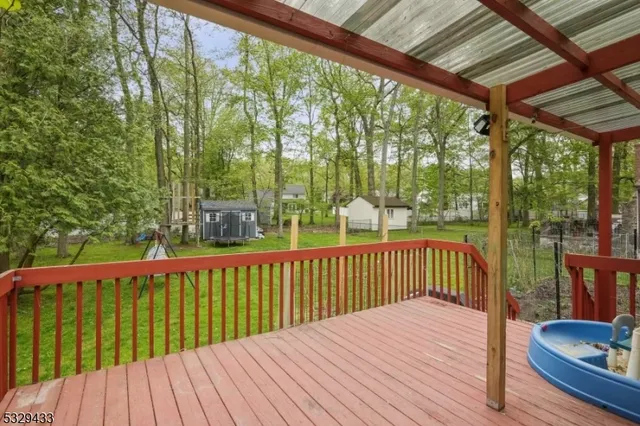 a view of balcony with wooden floor
