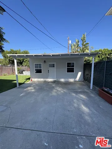 a front view of a house with a yard and a garage