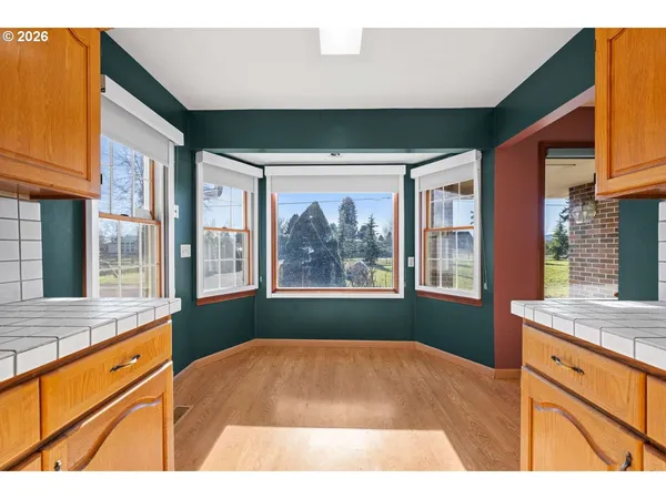 a open kitchen with granite countertop sink stove and cabinets