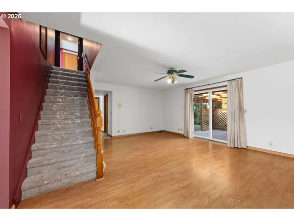 a view of an entryway with wooden floor