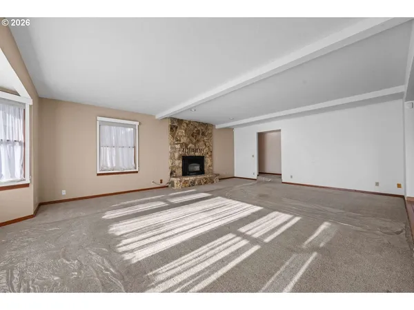 a view of empty room with windows