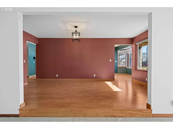 a view of livingroom with hardwood floor and kitchen