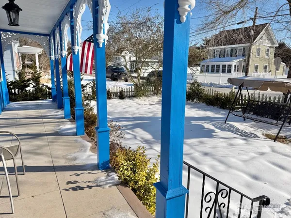 a view of a livingroom with furniture window and wooden floor