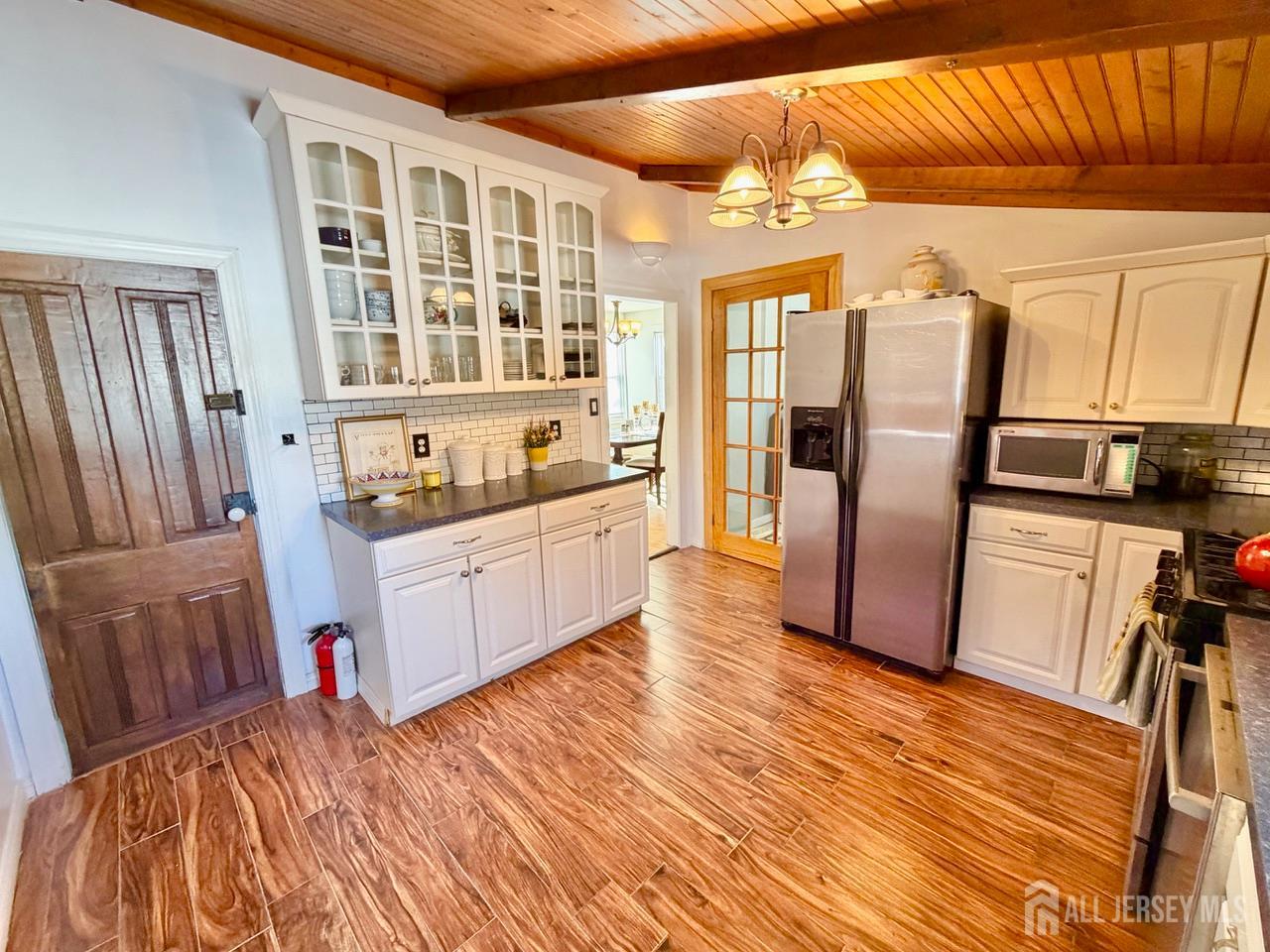 623-623 Main Street Leesburg, NJ 08327 - Photo 27 of 66 a living room with stainless steel appliances wooden floors and kitchen view
