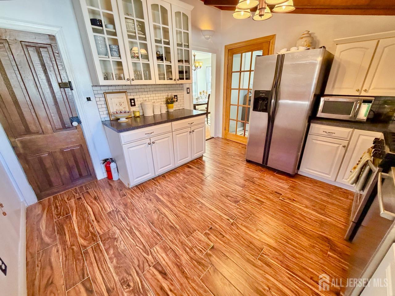 623-623 Main Street Leesburg, NJ 08327 - Photo 28 of 66 a view of an empty room with wooden floor and furniture