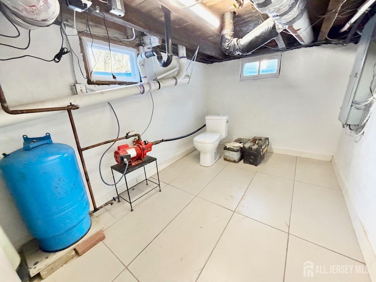 623-623 Main Street Leesburg, NJ 08327 - Photo 32 of 66 a bathroom with a sink and a mirror