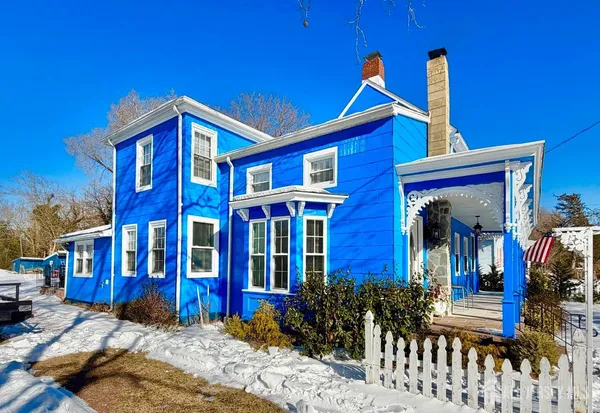 a view of a patio with a table and chairs