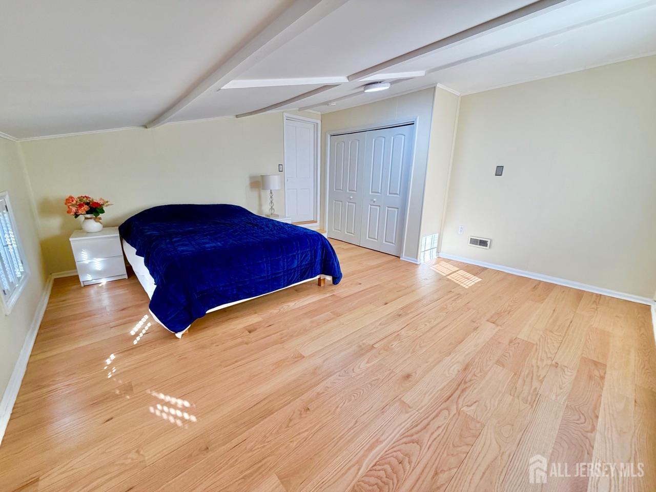 623-623 Main Street Leesburg, NJ 08327 - Photo 59 of 66 a room with a bed and a mirror