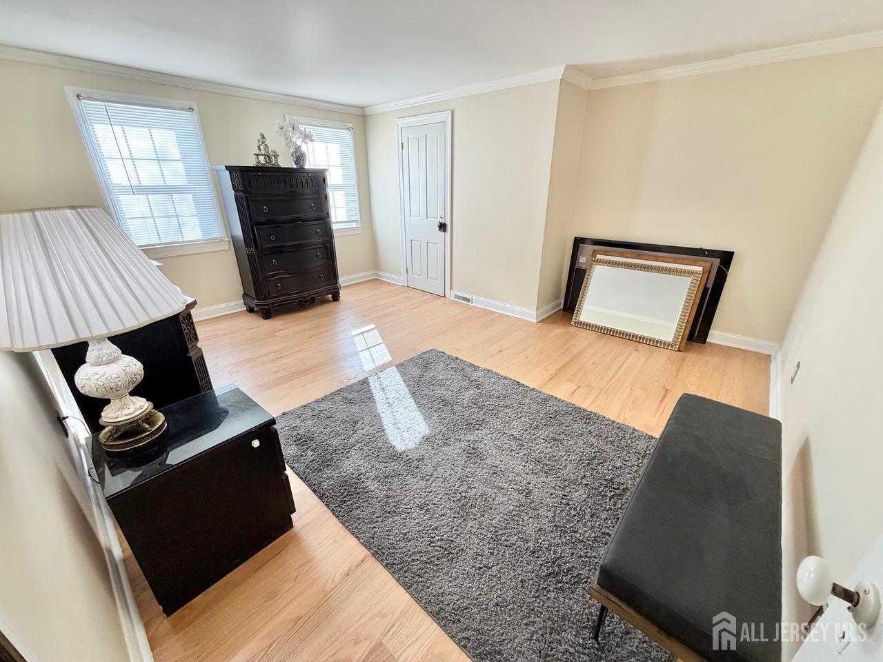 623-623 Main Street Leesburg, NJ 08327 - Photo 60 of 66 a bedroom with a bed and wooden floor