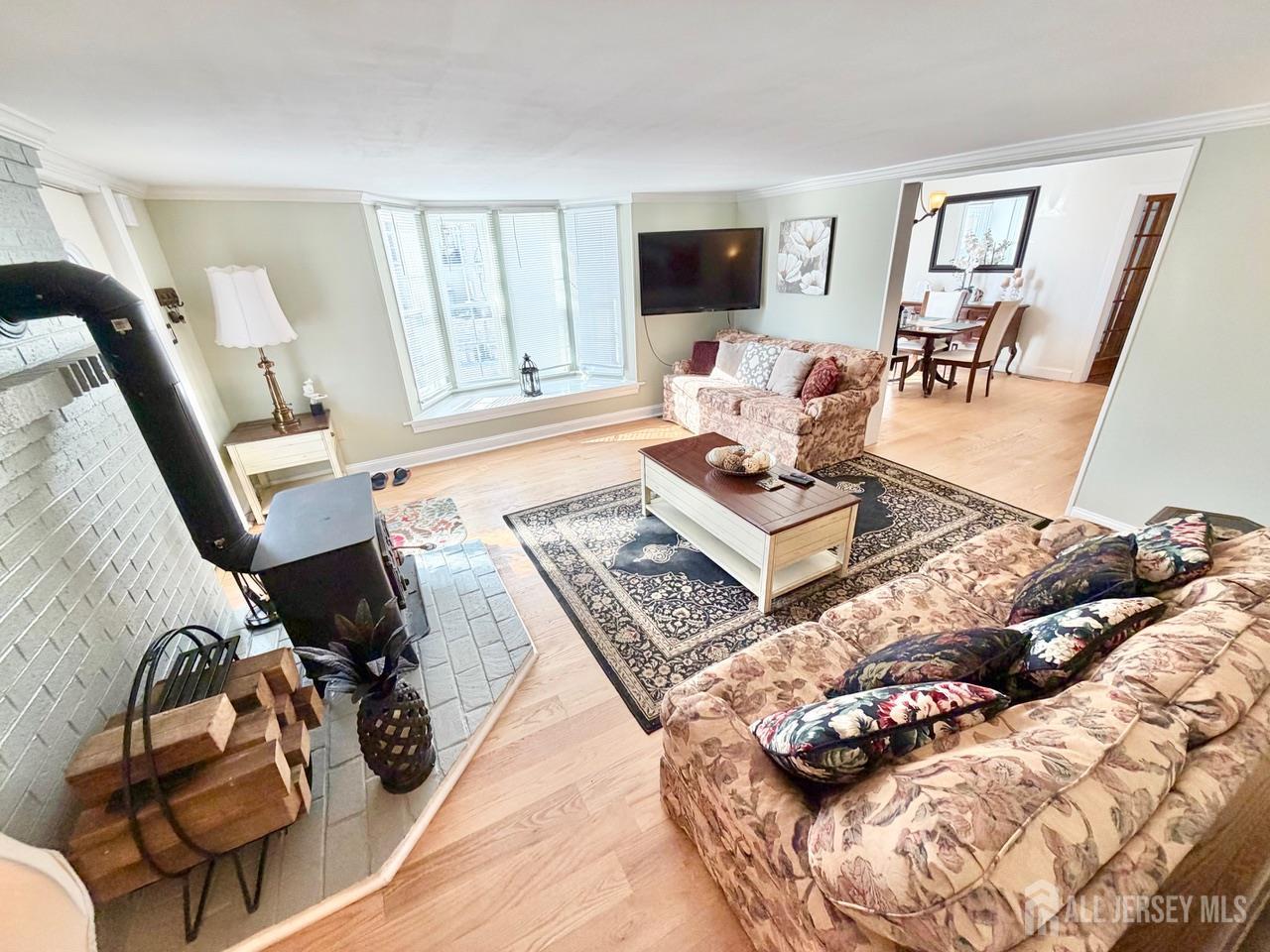 623-623 Main Street Leesburg, NJ 08327 - Photo 66 of 66 a living room with furniture and a flat screen tv