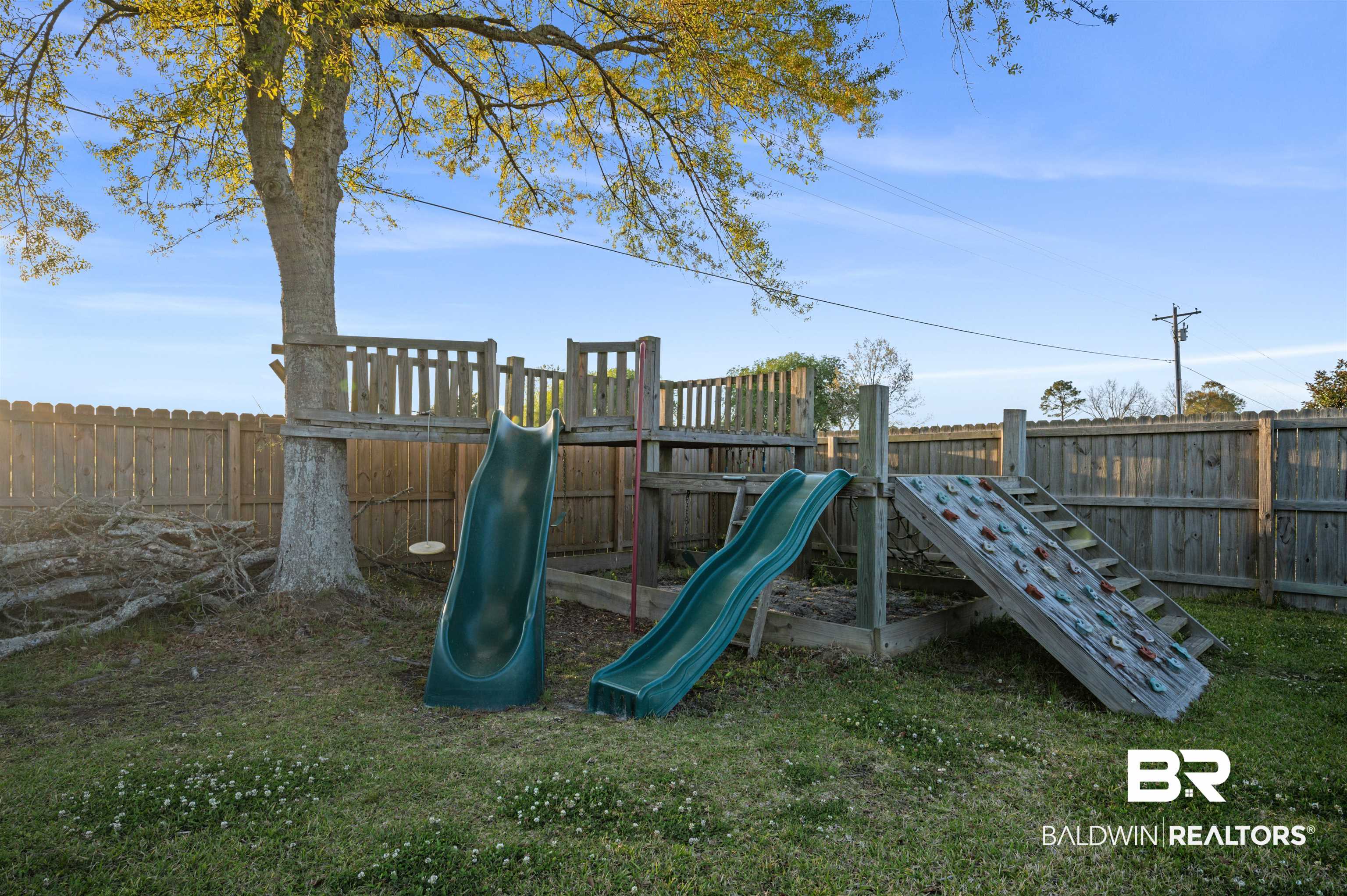 22370 Buck Road Robertsdale, AL 36567 - Photo 24 of 31 View of jungle gym featuring a fenced backyard