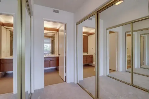 a view of a hallway with a livingroom and living room